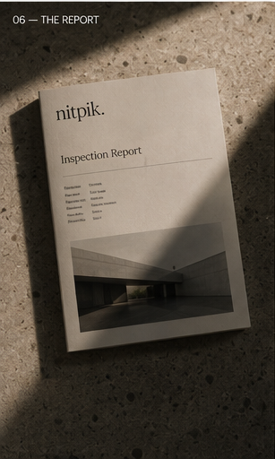 A printed Nitpik inspection report resting on a stone surface